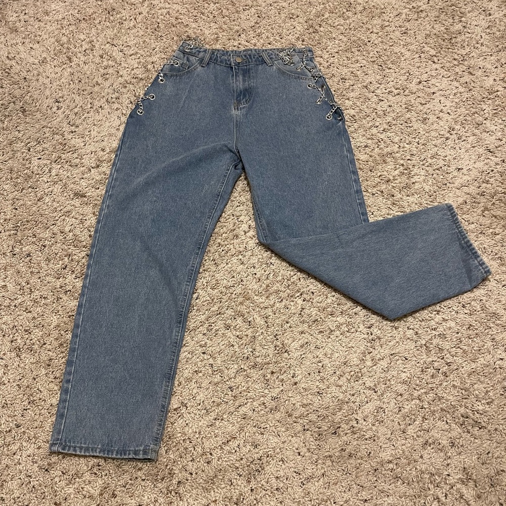 Jeans with open sides accented with chains. Size L but fits more like M.